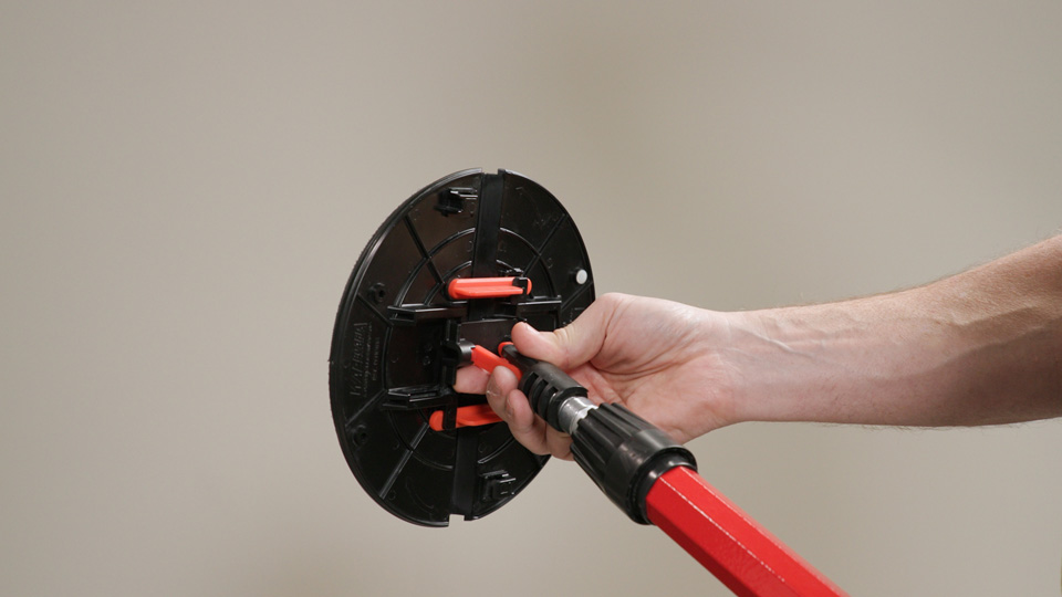 screwing the handle to the folding radial sander head